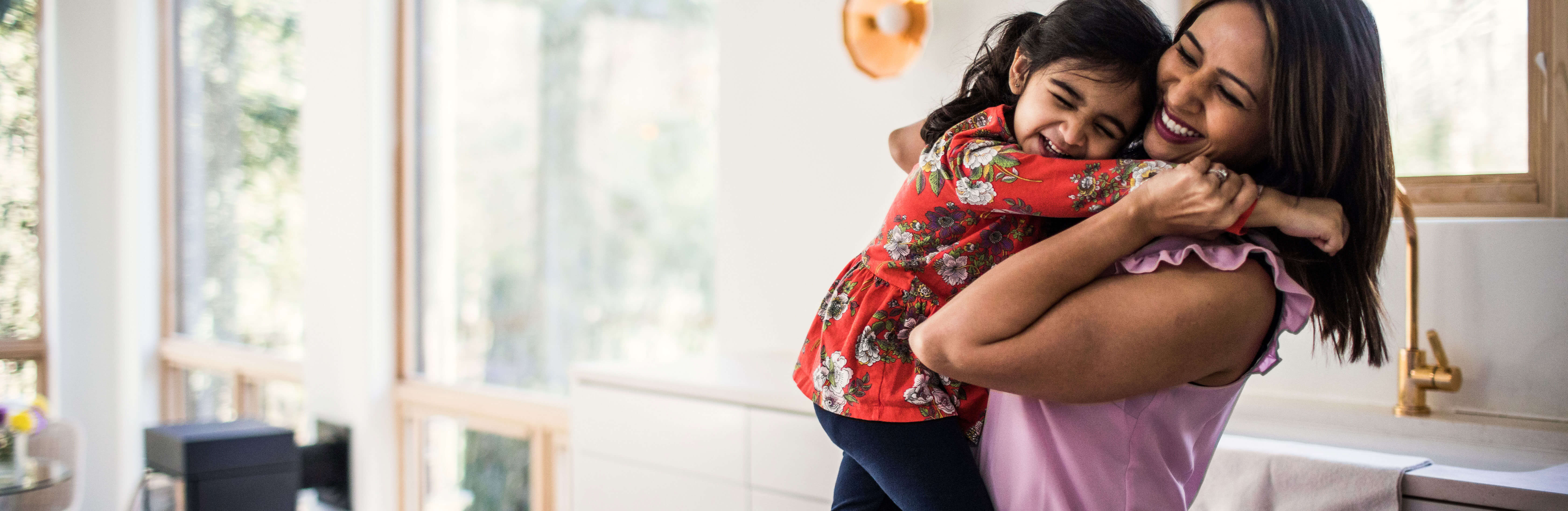 child hugging an adult